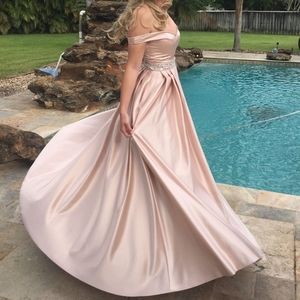 Beautiful blush pink prom dress with pockets.